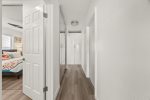 Hallway to bedrooms & patio entrance door